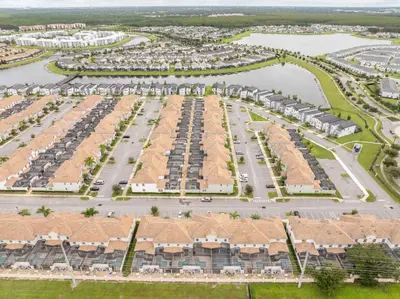 an aerial view of a parking lot at a resort at Gorgeous Four Bd w/ Pool close to Disney 5035 in Kissimmee
