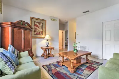 a living room with a couch and a coffee table at Kissimmee Condo with Resort Perks - 5 Mi to Disney! in Orlando