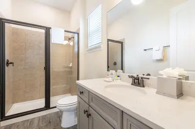a bathroom with a sink and a toilet and a shower at Sandy Shores Cottage Near Disney With Margaritaville Resort & Island H2O Access - 8077Kd in Orlando