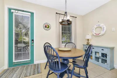 a dining room with a table and chairs at Seas The Day Cottage Near Disney With Margaritaville Resort & Island H2O Access - 8001Ff in Orlando