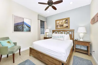 a bedroom with a bed and a ceiling fan at Seas The Day Cottage Near Disney With Margaritaville Resort & Island H2O Access - 8001Ff in Orlando