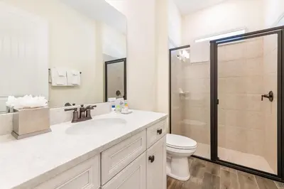 a bathroom with a sink and a toilet and a shower at Coral Cottage Near Disney With Margaritaville Resort & Island H2O Access - 8063Kd in Orlando