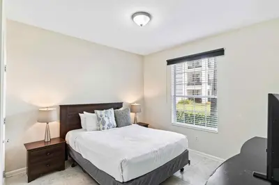 a bedroom with a bed and a window at First floor Vista Cay Condo wFREE Resort Access in Orlando