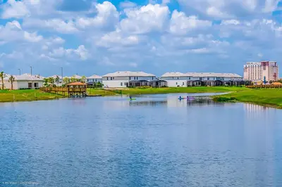 a large body of water with houses in the background at 4814 Lullaby Lane in Kissimmee