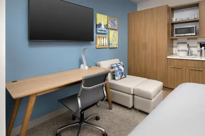 a room with a desk and a chair in a room at Element Orlando Universal Blvd. in Orlando