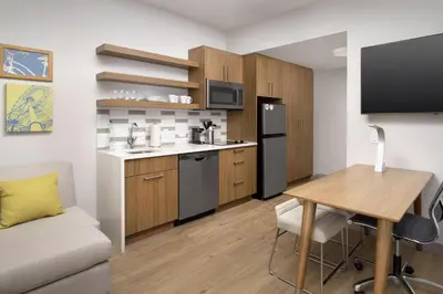 a small kitchen with a table and a desk at Element Orlando Universal Blvd. in Orlando