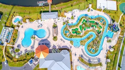 an overhead view of a pool at a resort at 4993FP TOWNHOUSE 4 BEDROOMS & 3 BATHROOMS + POOL in Kissimmee
