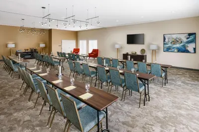 a conference room with long tables and chairs at Hilton Garden Inn Apopka City Center, Fl in Orlando