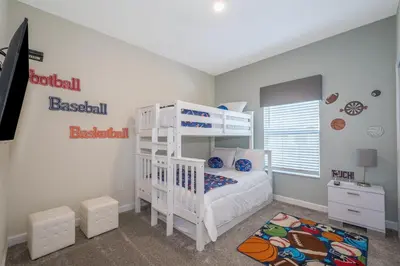 a bedroom with a white bunk bed and a bunk bed at 4975AN TOWNHOUSE 5 BEDROOMS & 4 BATHROOMS + POOL in Kissimmee