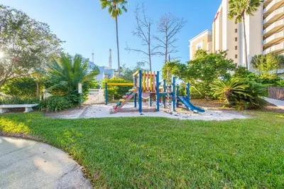 a playground in the grass in a park at Deluxe Studio w/ Lakeview - free parking/pool in Orlando