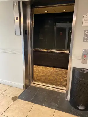 an entrance to an elevator in a building at Deluxe Studio w/ Lakeview - free parking/pool in Orlando