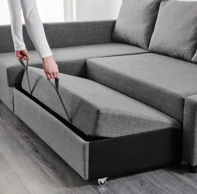 a person is pulling a bed out of a couch at Deluxe Studio w/ Lakeview - free parking/pool in Orlando