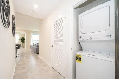 a laundry room with a washer and dryer at 3120-206DR STOREY LAKE, CONDO 2/2 GARDEN VIEW in Kissimmee