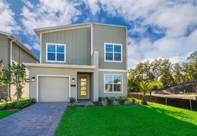 a house with a green lawn in front of it at 2731EE VILLA 5 BED/5 BA (SANITIZED) in Kissimmee