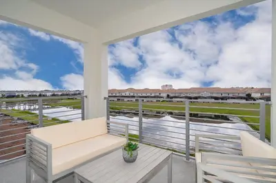 a porch with a bench and a view of the water at 3111-302HM STOREY LAKE, CONDO 2/2 LAKE VIEW in Kissimmee