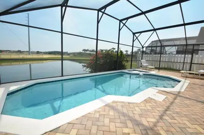 an indoor swimming pool in a building with a glass roof at 2685OL - Jagu Deaux (G) in Kissimmee