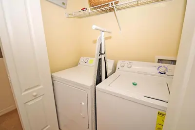 a laundry room with a washer and dryer at 8975CPR - Waites Home (G) in Kissimmee