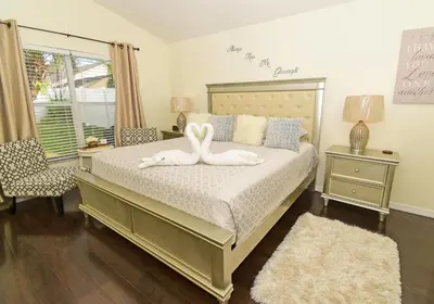 a bedroom with a bed with a towel animal on it at 4639EPD - Comfort Island (G) in Kissimmee
