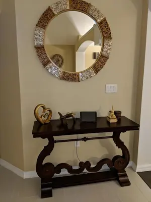 a table with a mirror on a wall at 4639EPD - Comfort Island (G) in Kissimmee
