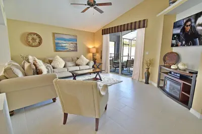 a living room with a couch and a table at 4639EPD - Comfort Island (G) in Kissimmee