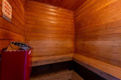a wooden sauna with a red trash can in it at VOS-2739PB-73 - Somerset Gardens (S) in Kissimmee