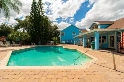 a swimming pool in front of a house at VOS-2739PB-73 - Somerset Gardens (S) in Kissimmee
