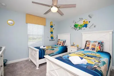 a childs bedroom with two beds and a ceiling fan at Ravishing Four Bd w/ Pool Close to Disney 4947 in Kissimmee