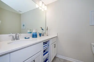 a bathroom with a sink and a mirror at 4731-206OR STOREY LAKE, CONDO 2/2 GARDEN VIEW in Kissimmee