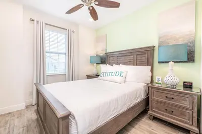 a bedroom with a large bed and a window at Fabulous Cottage Near Disney With Margaritaville Resort & Island H2O Access - 8075Kd in Orlando