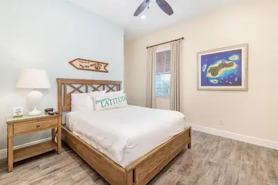 a bedroom with a bed and a nightstand and a window at Celestial Cottage Near Disney With Margaritaville Resort & Island H2O Access - 8036Dr in Orlando