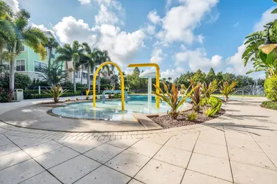 a pool with a water slide in a park at 2 Bedroom Vacation Condo 2011 in Kissimmee