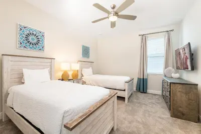 a bedroom with two beds and a ceiling fan at Vibrant Home With Private Pool, Pool Table Near Disney With Waterpark & Resort Access At Encore Resort - 7707Gr in Kissimmee