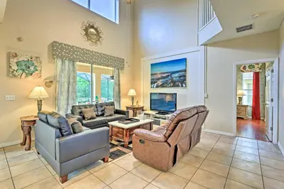a living room with two couches and a tv at 14 Mi to Disney Parks Spacious Kissimmee Home in Kissimmee