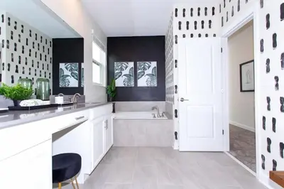 a white bathroom with a sink and a tub at Stunning 5 Bd w/ Pool Close to Disney @ Storey Lake 2767 in Kissimmee