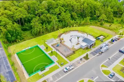 an aerial view of a large estate with a soccer field at Stunning 5 Bd w/ Pool Close to Disney @ Storey Lake 2767 in Kissimmee
