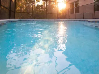a large pool of blue water in a building at Luxurious With Privacy In 5 Bedroom With Private Pool By Florida Dream Homes in Kissimmee