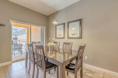 a dining room with a table and chairs at Resort Retreat in Kissimmee