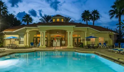 a house with a swimming pool in front of it at Crystal Villa in Kissimmee
