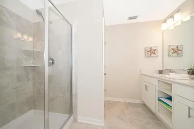 a bathroom with a shower and a sink at 3180-202BV STOREY LAKE, CONDO 2/2 GARDEN VIEW in Kissimmee