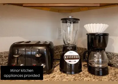 a blender and a toaster sitting on a counter at 320 Pet Friendly 6BD Villa - PoolSpa in Orlando