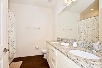 a bathroom with a sink and a toilet at Great and practical townhouse in gated community, sleeps 6 10 min to Disney! in Orlando