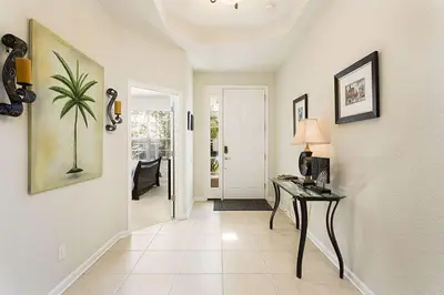a hallway with a desk in a home with a door at bsv_villa7747 in Orlando