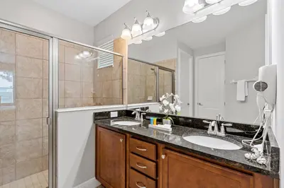 a bathroom with a sink and a shower at Encore Resort 6 Bedroom Home with Pool 2301 in Orlando