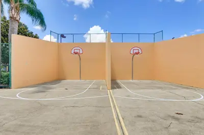 a basketball court with two hoops on a wall at Steps to Pool Winter Garden House with Lanai! in Orlando