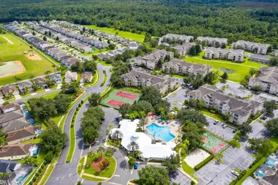an aerial view of an apartment complex with a park at Immaculate 4 bedrooms 3 bathroom in Windsor Palms villa in Kissimmee