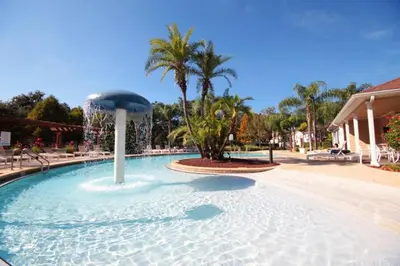 a large swimming pool with a fountain in the middle at 5370 INCREDIBLE 8 MINS TO DISNEY LUCAYA VILLAGE RESORT in Kissimmee