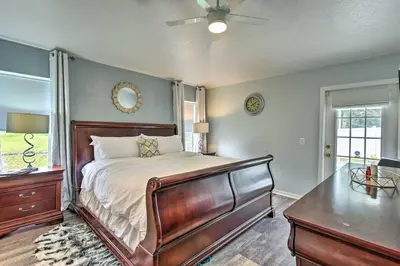 a bedroom with a bed and a dresser and a window at Apopka Single-Story Home with Private Lanai and Pool! in Orlando