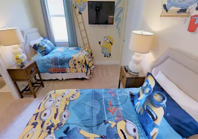 a bedroom with two beds and a tv in it at 7613-IBRAHIM · 7613 Paradise at Encore wiith Private pool in Orlando