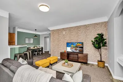 a living room with a couch and a table at 2 Bedroom Vacation Condo 2016 in Kissimmee
