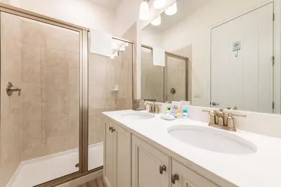 a bathroom with two sinks and a shower at Happy Ours Cottage Near Disney With Private Hot Tub And Margaritaville Resort & Island H20 Waterpark Access - 3086Kl in Orlando